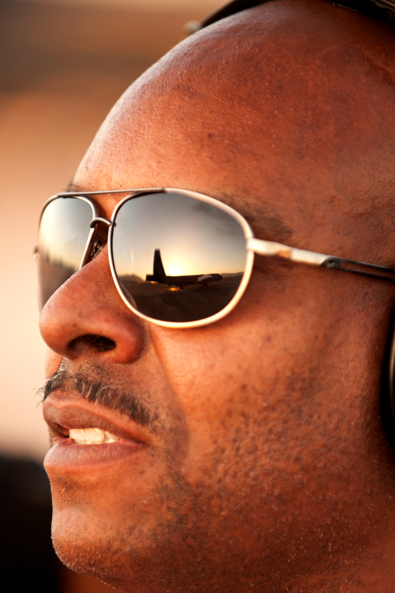 U.S. Air Force Staff Sgt. Terance Thomas, 307th Aircraft Maintenance Squadron crew chief, watches a B-52H Stratofortress taxi into the sunset during a Mission Employment exercise, Nellis Air Force Base, Nev., June 12, 2012. Personnel from 307th and 2nd Bomb Wings from Barksdale AFB, La., generated 14 B-52 sorties in support of the exercise. (U.S. Air Force photo by Master Sgt. Greg Steele/Released)