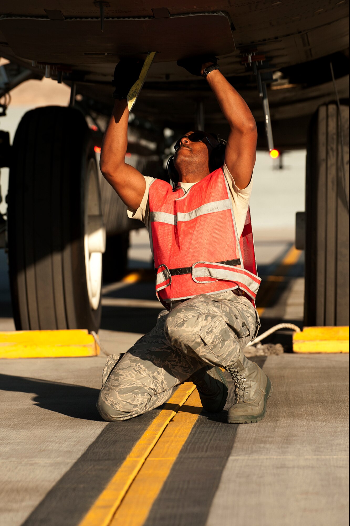 U.S. Air Force Staff Sgt. Terance Thomas, 307th Aircraft Maintenance Squadron crew chief, closes the aircrew hatch of a B-52 Stratofortress prior to its taxiing for a sortie in support of a Mission Employment exercise, Nellis Air Force Base, Nev., June 12, 2012. The B-52 is assigned to the 93rd Bomb Squadron, 307th Bomb Wing, Barksdale AFB, La. (U.S. Air Force photo by Master Sgt. Greg Steele/Released)