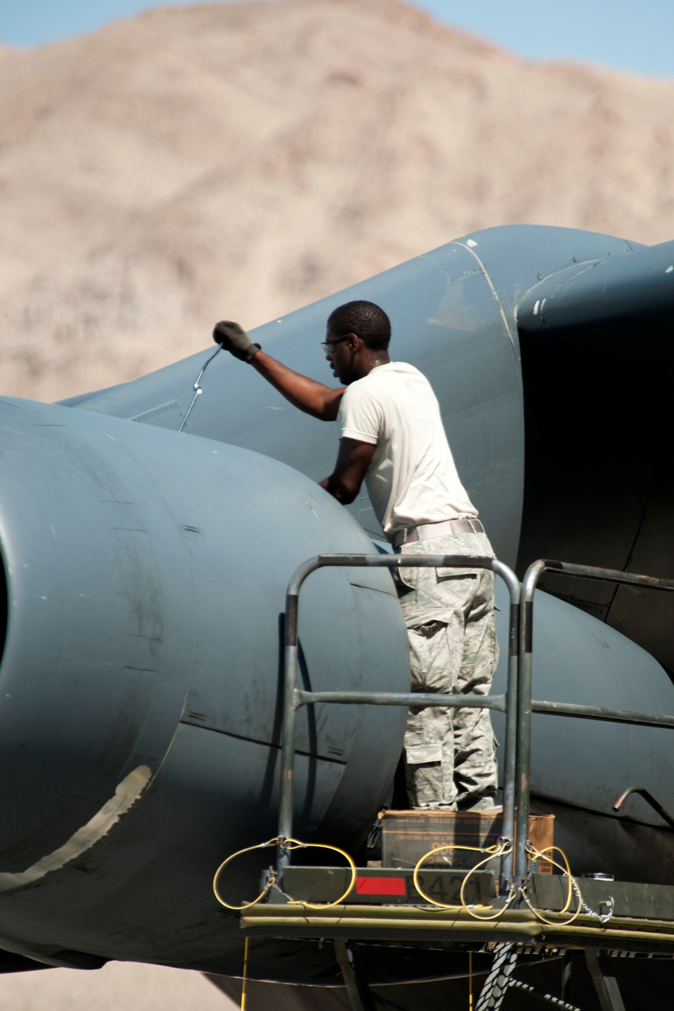 U.S. Air Force Airman 1st Class Stuart Mighty, 2nd Aircraft Maintenance Squadron crew chief, performs a post flight inspection on an Air Force Reserve Command B-52H Stratofortress after its return from a sortie in support of the Mission Employment exercise, Nellis Air Force Base, Nev., June 10, 2012. Personnel from 307th and 2nd Bomb Wings from Barksdale AFB, La., generated 14 B-52 sorties in support of the exercise. (U.S. Air Force photo by Master Sgt. Greg Steele/Released)