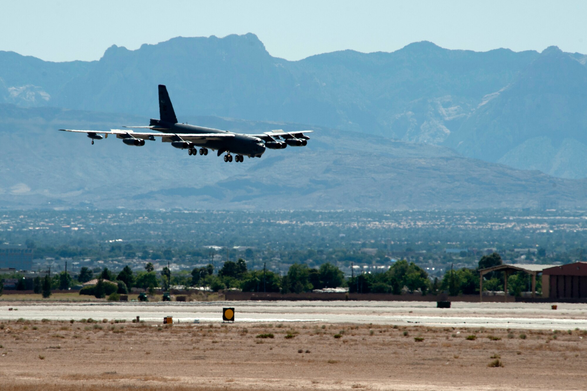 A B-52H Stratofortress returns from a sortie in support of a Mission Employment exercise, Nellis Air Force Base, Nev., June 10, 2012. The B-52 is one of three deployed to Nellis in support of the exercise and are assigned to the 93rd Bomb Squadron, 307th Bomb Wing, Barksdale AFB, La. (U.S. Air Force photo by Master Sgt. Greg Steele/Released)