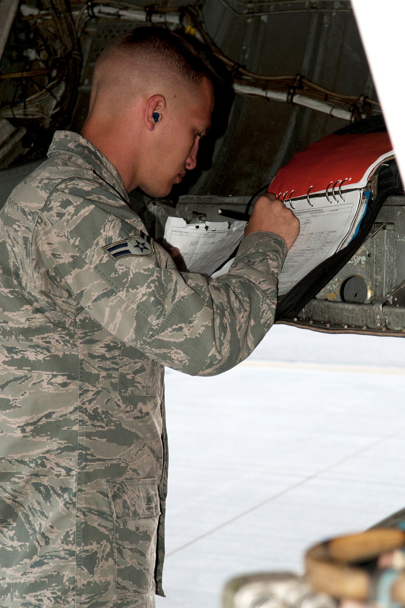 U.S. Air Force Airman 1st Class Brad Boyd, 2nd Aircraft Maintenance Squadron crew chief, updates the aircraft forms on a B-52H Stratofortress in support of the Mission Employment exercise, Nellis Air Force Base, Nev., June 10, 2012. The ME is the capstone graduation exercise for soon to be Weapons Officers, and B-52s from the 93rd Bomb Squadron, 307th Bomb Wing, at Barksdale AFB, deployed to Nellis in support of the exercise. (U.S. Air Force photo by Master Sgt. Greg Steele/Released)