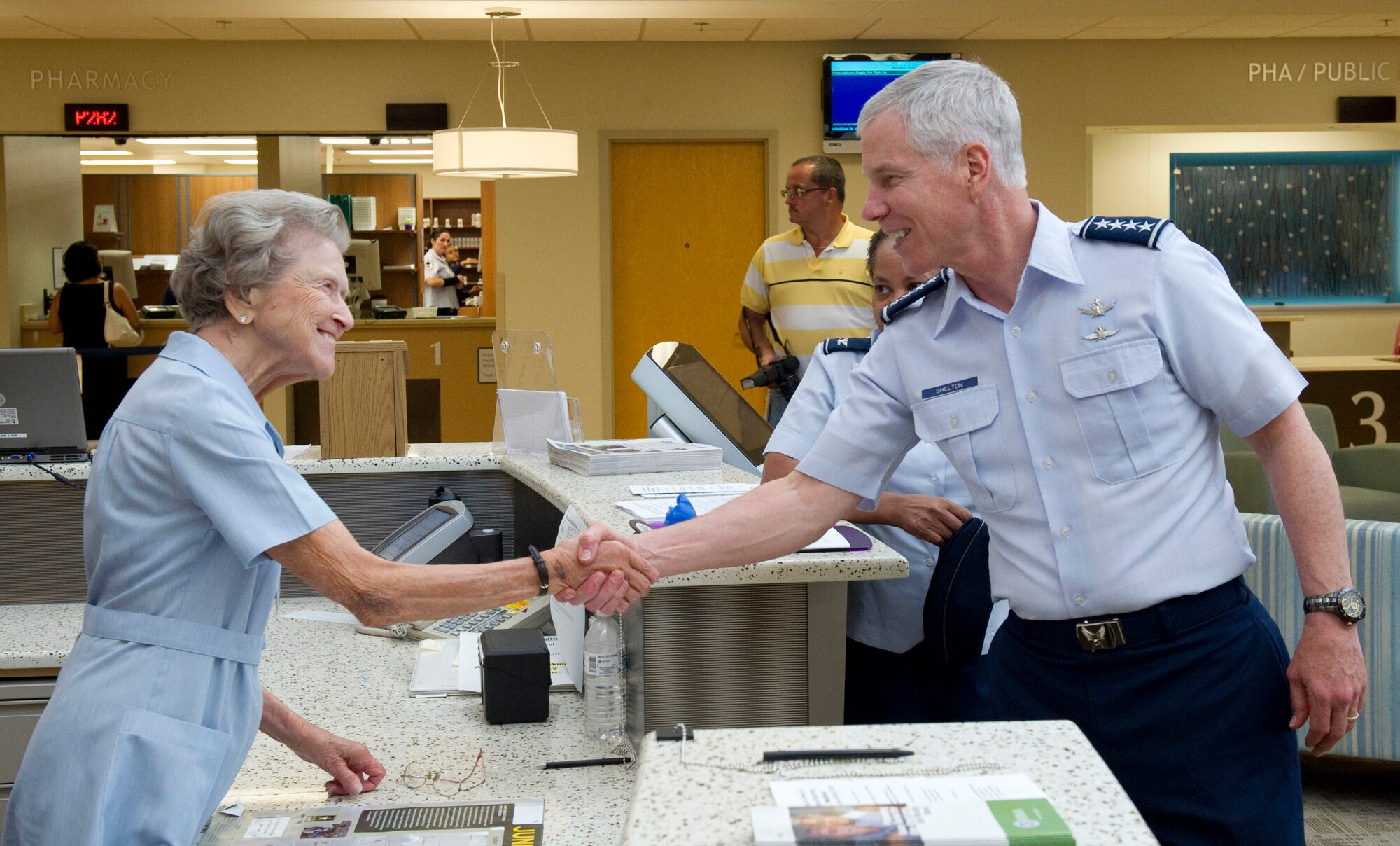 Gen. William L. Shelton, commander, Air Force Space Command, gets a hearty
handshake from 45th Medical Group Red Cross volunteer Lillian Hamlin, during the
commander’s visit to the Wing Monday. 45th Space Wing Red Cross volunteers
donated more than 17,000 hours last year. Gen. Shelton and Chief Master Sergeant
Linus Jordan, Command Chief Master Sergeant, Air Force Space Command, landed at the Patrick Airstrip Sunday evening, and after a series of briefings Monday morning, toured the new Bowling Center (which will celebrate their Grand Opening
11 a.m. June 26), the Security Forces Squadron and the newly renovated 45th Medical Group clinic. (Photo by Matthew Jurgens)