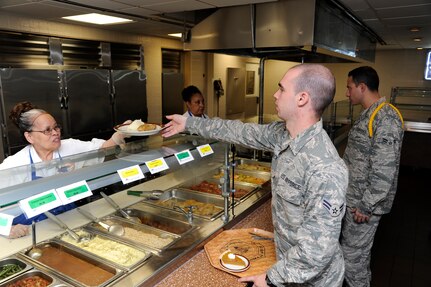 Airman 1st Class Detrick, 558th Flying Training Squadron student, orders Mrs. Z's Baked Chicken, a healthy food choice, for lunch at the Joint Base San Antonio-Randolph Rendezvous Dining Facility June 21.  (U. S. Air Force Photo by Don Lindsey)
