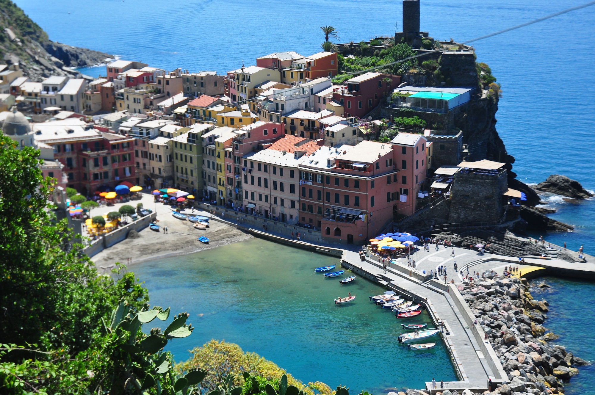 A castle ruin overlooks the fishing town of Vernazza.  Cinque Terre’s literal translation is “Five Lands” which is well suited for the series of five villages stretched along the Italian Riviera. (U.S. Air Force photo by Staff Sgt. Evelyn Chavez)