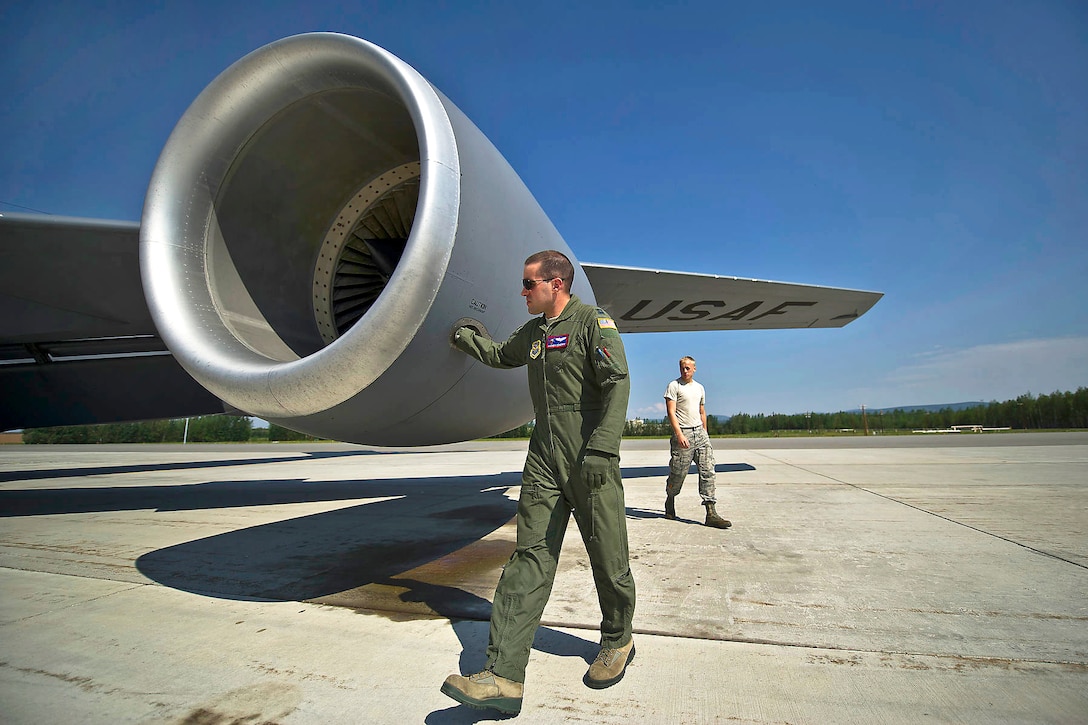U.S. Air Force Capt. Andrew Scherff and Senior Airman Thomas Schuman conduct a preflight check of a U.S. Air Force KC-135 Stratotanker before a refueling mission during Red Flag-Alaska 12-2 on Eielson Air Force Base, Alaska, June 20, 2012. Scherff, a KC-135 pilot, and Schuman, a crew chief, are assigned to McConnell Air Force Base, Kan.