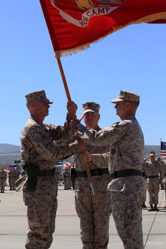 Col. Mike Lawrence retired and relinquished command of Marine Corps Air Station Camp Pendleton to Col. Lawrence E. Killmeier during a change of command ceremony on the flightline of MCASCP Calif., June 22.