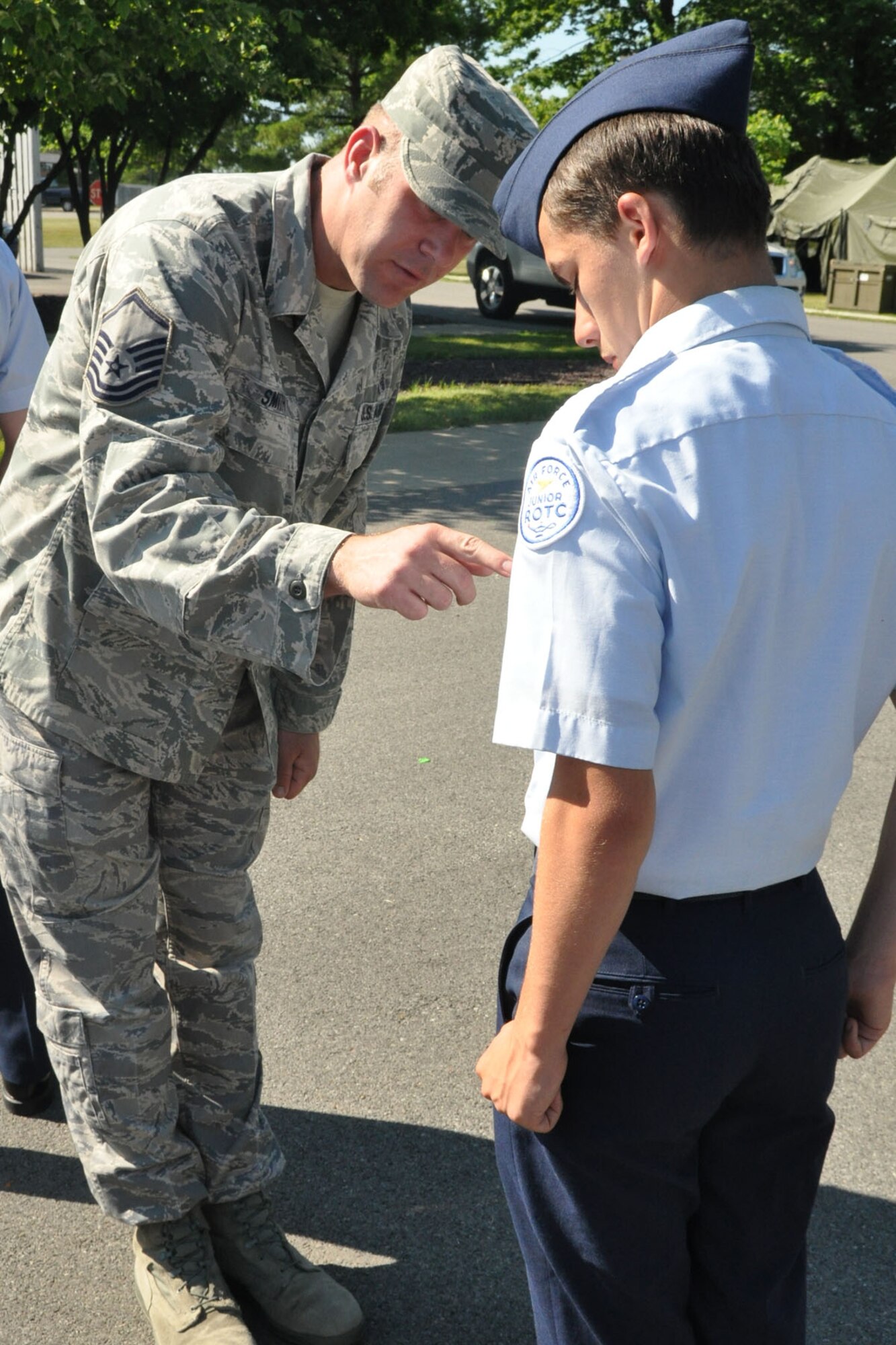 YOUNGSTOWN AIR RESERVE STATION, Ohio -- Air Force Reserve Lt. Col. Don Richey, acting commander of the 910th Operation Group,  looks on as 10-year-old Hunter Crites of Austintown, Ohio signs an oath document just after being sworn in as an honorary second lieutenant here June 22. Hunter was selected by Akron Children's Hospital Mahoning Valley to be honored as a pilot for a day. He is being treated for Cerebral Palsy. Hunter was taxied aboard a C-130 Hercules aircraft and given a special tour of the installation. The 910th Airlift Wing pilot for a day program began in 2000 to help bring a ray of sunshine into the lives of children being treated for chronic or life threatening conditions 