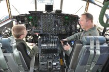 YOUNGSTOWN AIR RESERVE STATION, Ohio -- Air Force Reserve Capt. George Lenahan, a command pilot with the 910th Airlift Wing, talks with 10-year old Hunter Crites about flying a C-130 airplane here June 22. Hunter was selected by Akron Children's Hospital Mahoning Valley to be honored as a pilot for a day. He is being treated for Cerebral Palsy. Hunter was taxied aboard a C-130 Hercules aircraft and given a special tour of the installation. The 910th Airlift Wing pilot for a day program began in 2000 to help bring a ray of sunshine into the lives of children being treated for chronic or life threatening conditions.