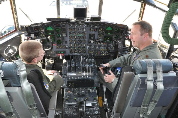 YOUNGSTOWN AIR RESERVE STATION, Ohio -- Air Force Reserve Capt. George Lenahan, a command pilot with the 910th Airlift Wing, talks with 10-year old Hunter Crites about flying a C-130 airplane here June 22. Hunter was selected by Akron Children's Hospital Mahoning Valley to be honored as a pilot for a day. He is being treated for Cerebral Palsy. Hunter was taxied aboard a C-130 Hercules aircraft and given a special tour of the installation. The 910th Airlift Wing pilot for a day program began in 2000 to help bring a ray of sunshine into the lives of children being treated for chronic or life threatening conditions. U.S. Air Force photo by Maj. Brent J. Davis

