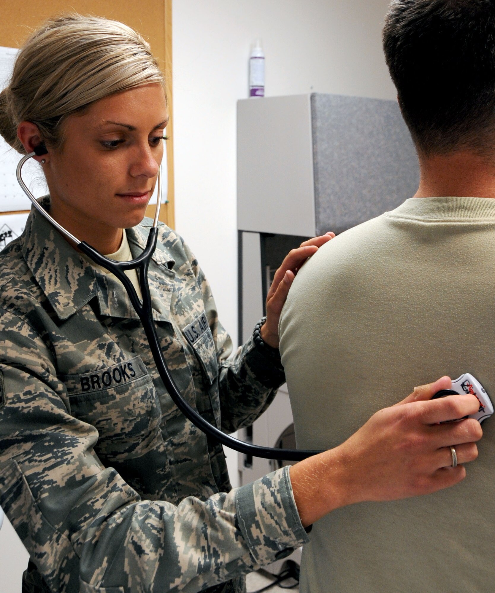 Senior Airman Bryenna Brooks, 2nd Aerospace Medicine Squadron, listens to the breathing of a patient on Barksdale Air Force Base, La., June 13. Brooks deployed to Afghanistan in support of Operation Enduring Freedom, where she was the single convoy medic for 25 missions. (U.S. Air Force photo/Senior Airman La'Shanette V. Garrett)(RELEASED)
