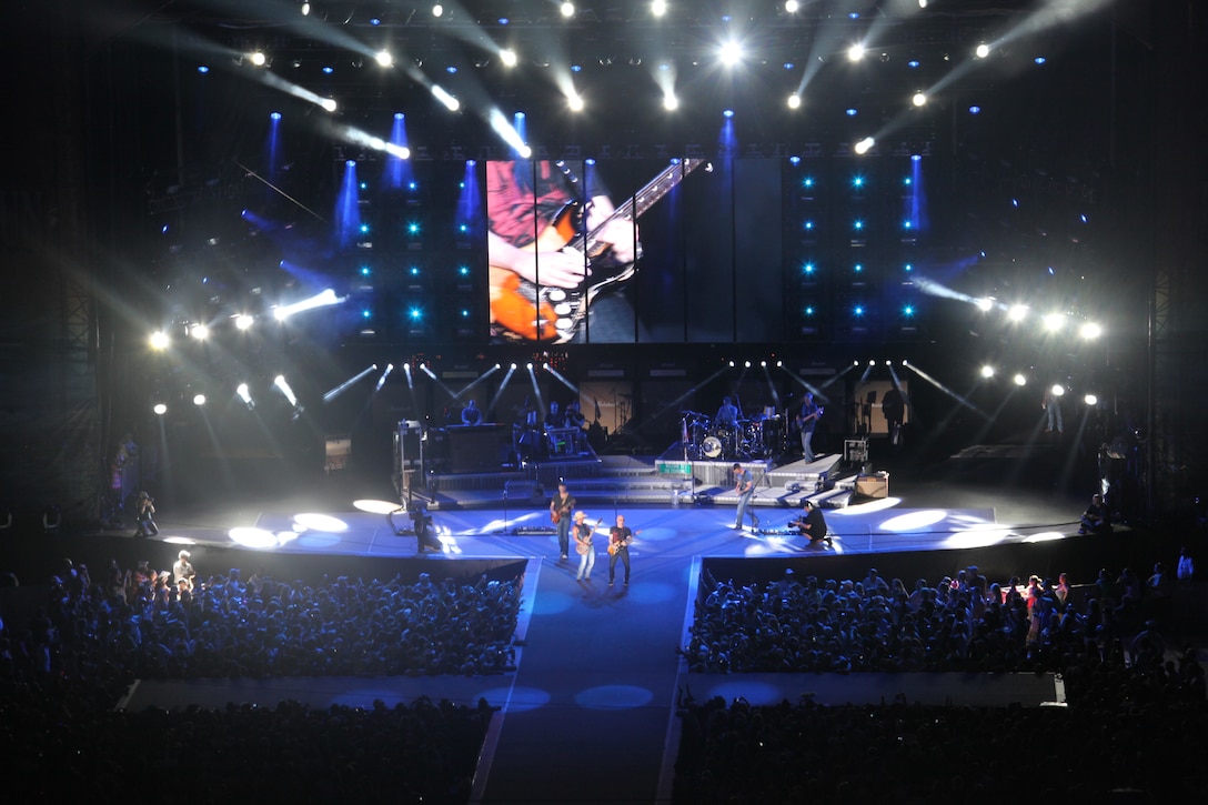Country music artist Kenney Chesney performs for thousands of people in attendance at the 2012 Brothers of the Sun Tour at the Bank of America Stadium in Charlotte, N.C., June 24. A group of more than 70 Marines loaded up two busses and made the trip to see the concert which featured Jake Owen, Grace Potter and the Nocturnals, Tim McGraw and Kenney Chesney.