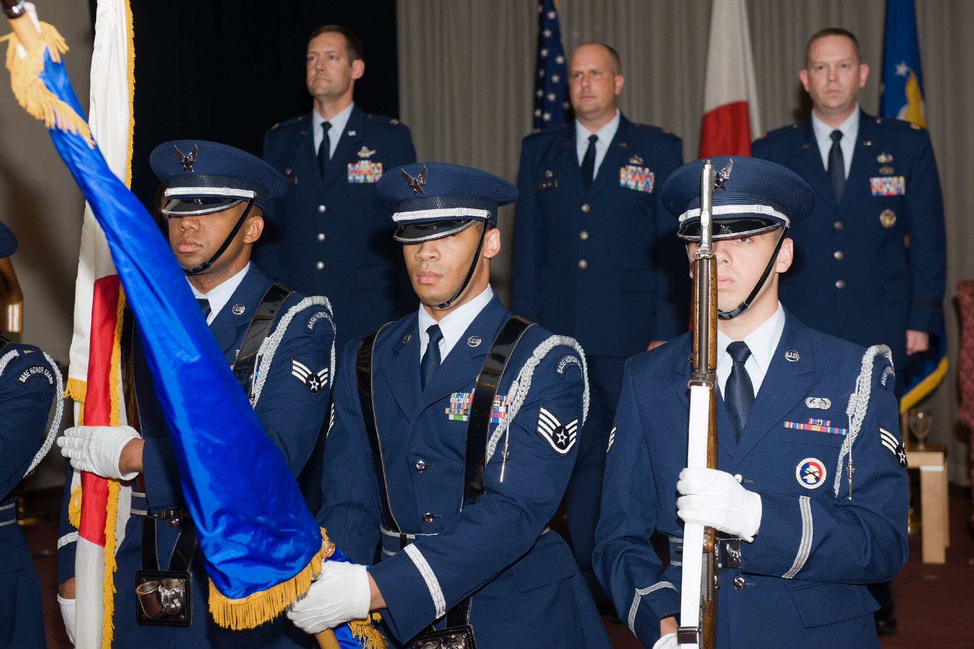 YOKOTA AIR BASE, Japan -- Yokota Honor Guard members post the colors during the 374th Contracting Squadron change of command ceremony at Yokota Air Base, Japan, on June 22, 2012. The Honor Guard performs at various military ceremonies throughout the year. (U.S. Air Force photo by Osakabe Yasuo)