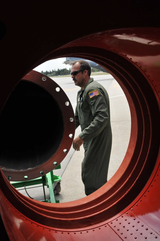Senior Master Sgt. Jack Goeken, loadmaster, 187th Airlift Squadron, Cheyenne, Wyo., prepares to load a U.S. Forest Service Modular Airborne Firefighting System II nozzle onto a Wyoming Air National Guard C-130, June 24, 2012. The Wyoming Air National Guard MAFFS unit has been activated to support the Rocky Mountain area fires, they will base out of Colorado Springs, Colo. (U.S. Air Force photo by Staff Sgt. Natalie Stanley)