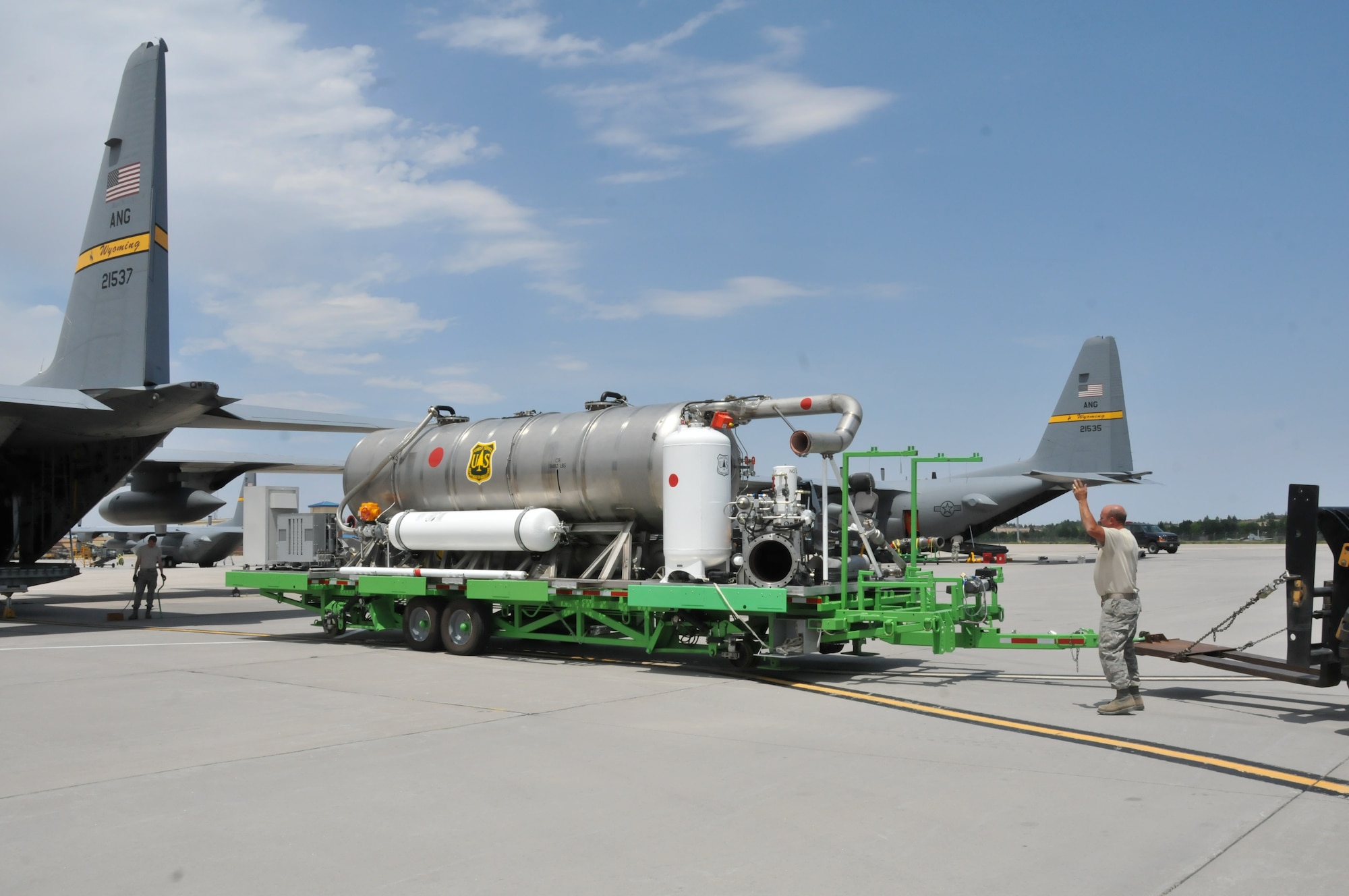 Members of the 153rd Airlift Wing, Cheyenne, Wyo., prepare to load a U.S. Forest Service Modular Airborne Firefighting System II onto a Wyoming Air National Guard C-130, June 24, 2012. The Wyoming Air National Guard MAFFS unit has been activated to support the Rocky Mountain area fires, they will base out of Colorado Springs, Colo. (U.S. Air Force photo by Staff Sgt. Natalie Stanley)


