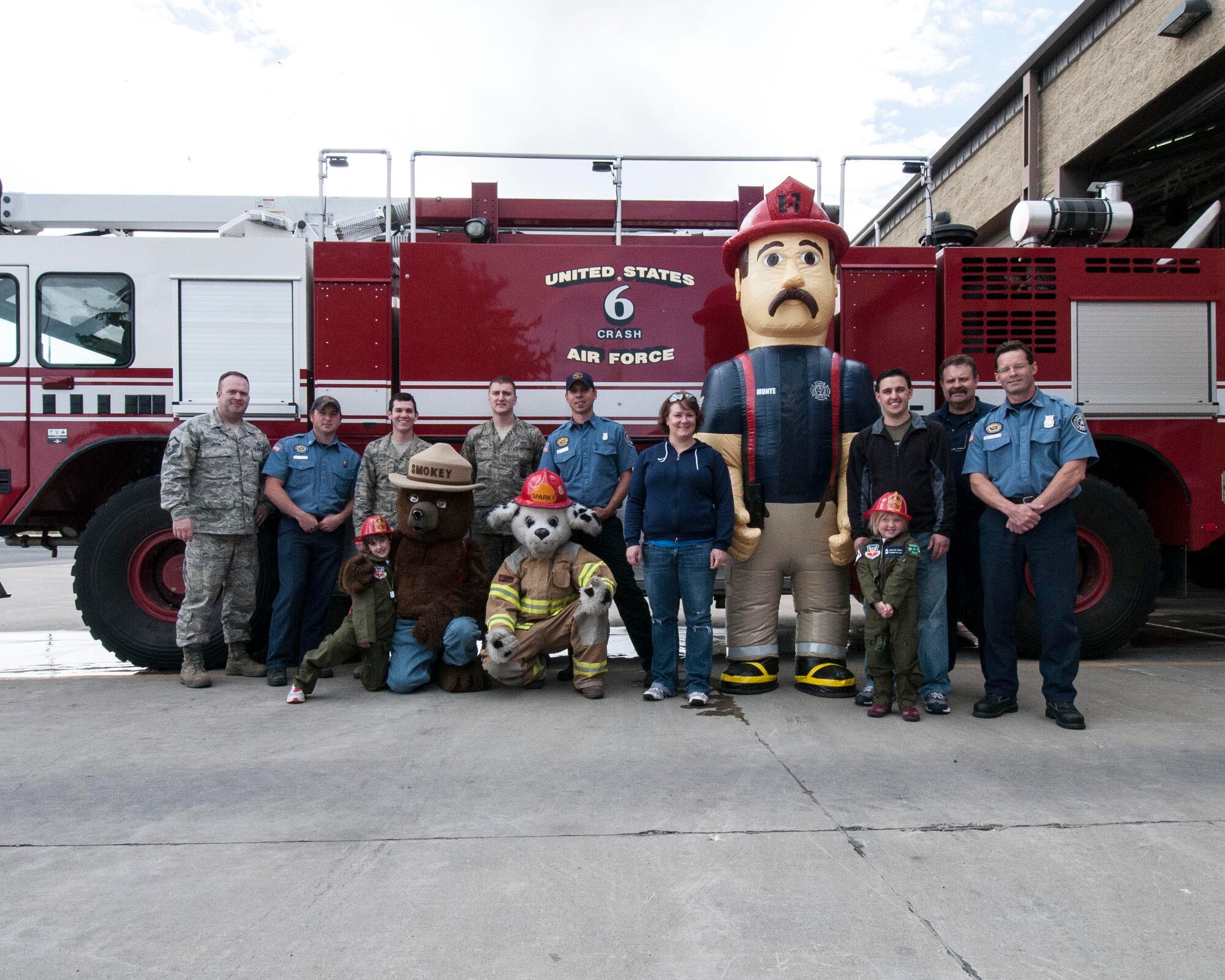 Anna and Madeline Cumbie, accompanied by their parents, Brian and Jenny, visited the Fairchild AFB Fire Department during Pilot for a Day training. The two sisters were selected to participate in the 141st Air Refueling Wings honorary pilot training program May 30, 2012 in Spokane, WA. The girls received fire hats, toured the facility and rode in a fire truck. (U.S. Air Force photo by Master Sgt. Michael Stewart/Released)