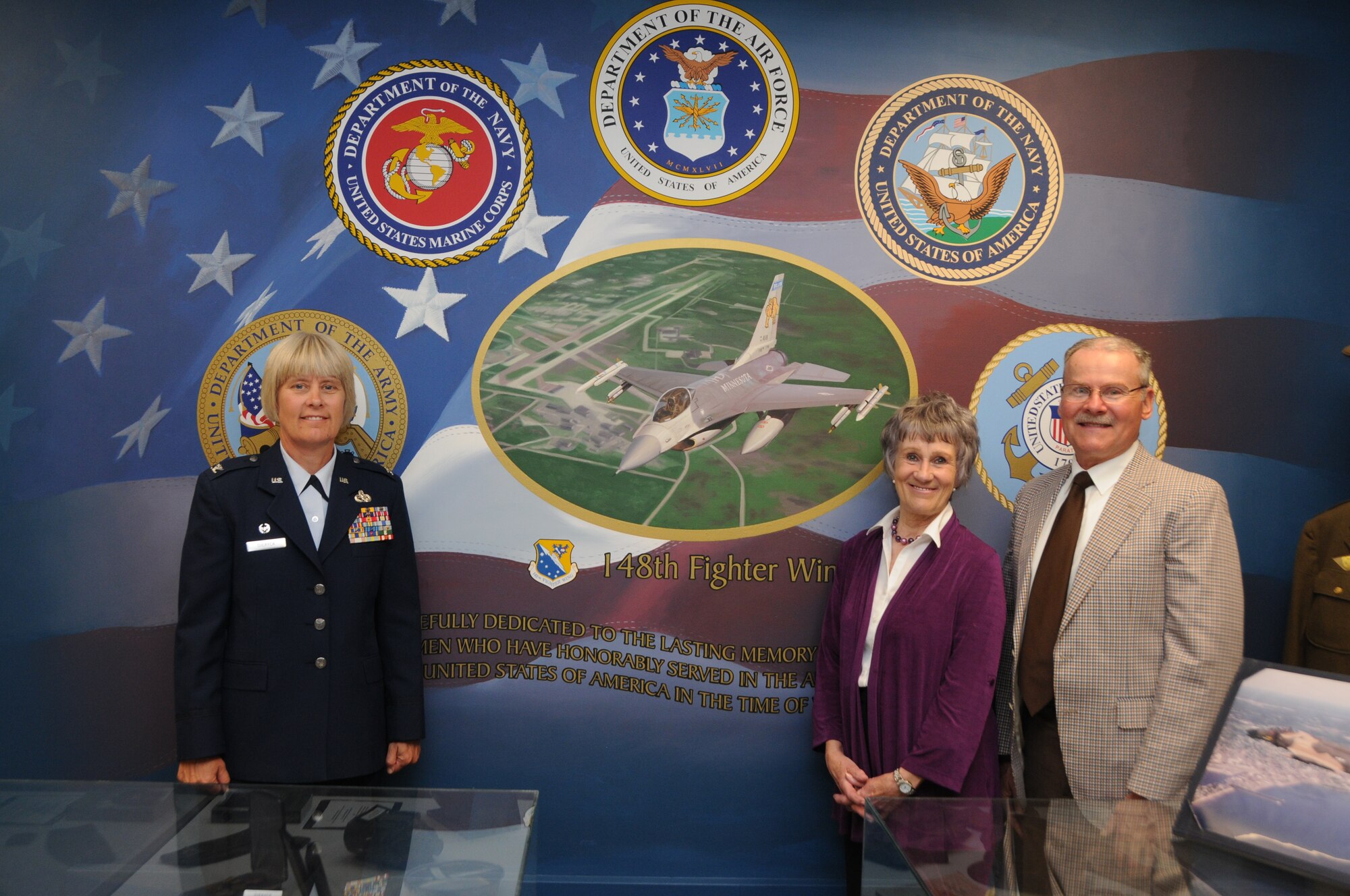 148th Fighter Wing Mission Support Group Commander Col. Penny Dieryck poses
with Hermantown Historical Society Chair Sandy Reinke and Co-Chair Bob
Swanson June 23, 2012 in front of the Society's newly dedicated mural in
their military room.  The mural depicts a 148th Fighter Wing F-16 in flight
surrounded by the seals of the U.S armed forces, and was dedicated to the
service of the area's veterans.  (National Guard photo by Master Sgt. Ralph
J. Kapustka.)