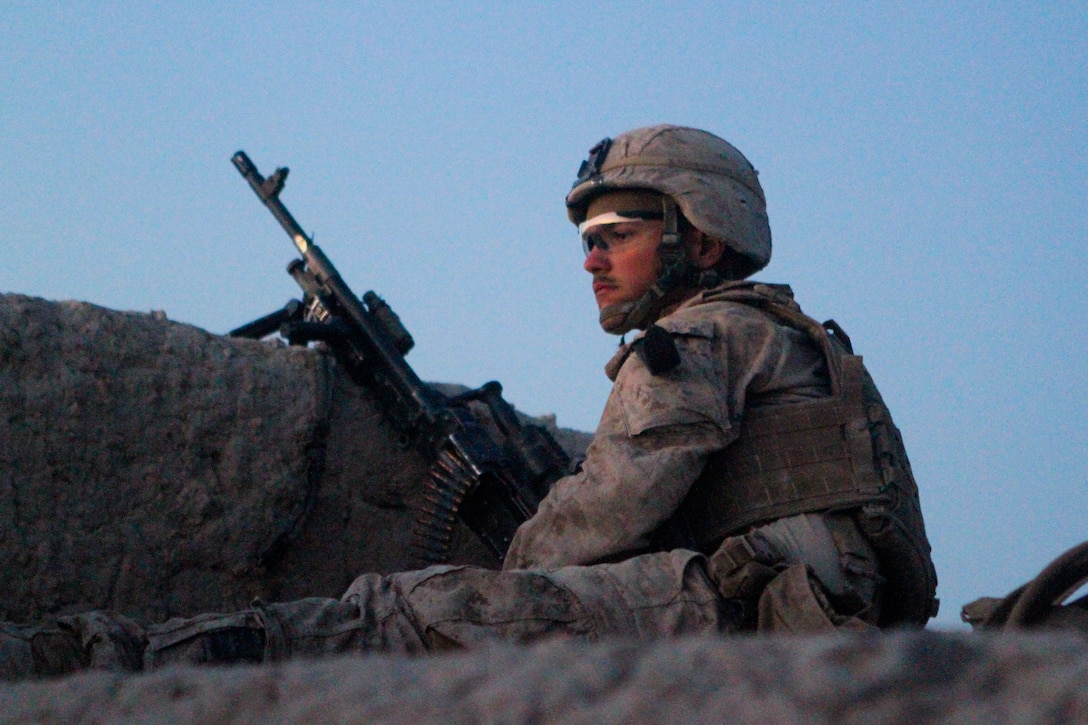 Lance Cpl. Christopher Yudin, a machinegunner with 2nd Battalion, 5th Marines, Regimental Combat Team 6, sits on security post, June 3, 2012. Yudin was born in Finland and is the son of a Mexican diplomat.