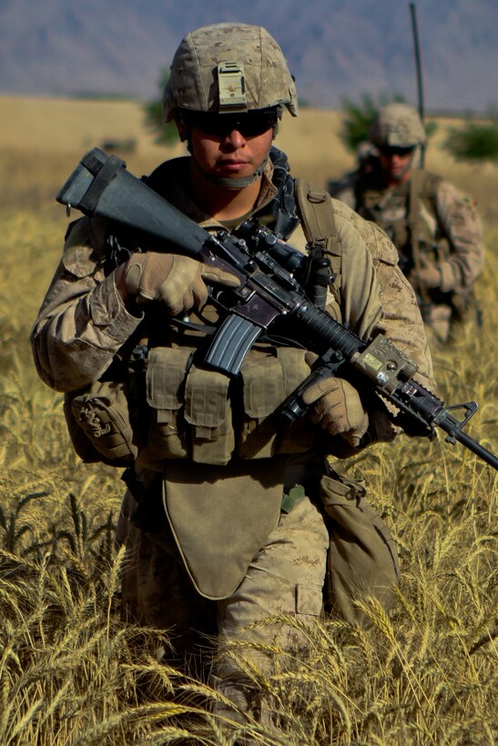 Petty Officer 3rd Class Norberto Zamora a corpsman with 2nd Battalion, 5th Marines, Regimental Combat Team 6, patrols to a new compound during Operation Jaws, May 27, 2012. Zamora wanted to be a corpsmen for the challenge of working with Marines.