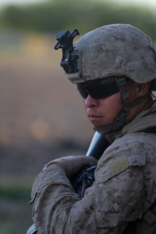 Petty Officer 3rd Class, Norberto Zamora, a hospital corpsman with 2nd Battalion, 5th Marines, Regimental Combat Team 6, watches the horizon during a security halt, July 1, 2012. Zamora’s training was put to the test within his first week in Afghanistan when troops step on an improvised explosive device while on a patrol.