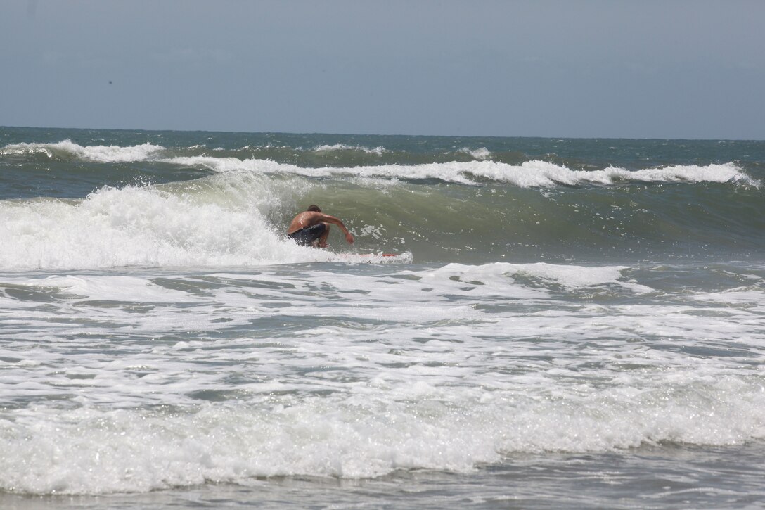 Cpl. Chase Dale surfs at Onslow Beach aboard Marine Corps Base Camp Lejeune, June 15. Dale said that surfing improves self-confidence along with stamina and endurance.