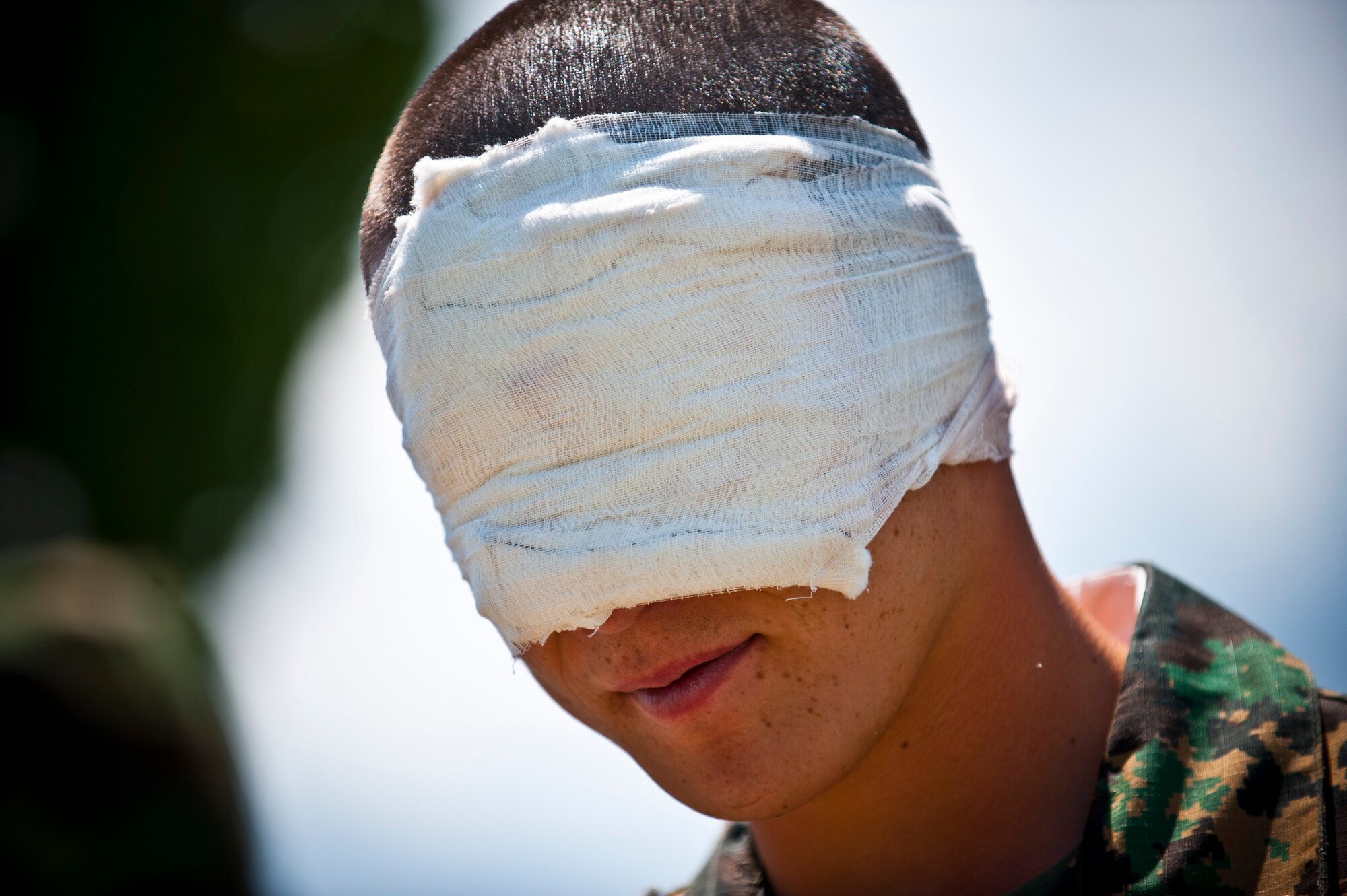A Kyrgyz Republic soldier waits to be treated for simulated injuries as part of a mass casualty scenario during Exercise Regional Cooperation 12 at the Koi Tash Military Academy, Kyrgyzstan, June 22, 2012. The scenario tested first responders on reaction time, aid requirements and rate of evacuation. Regional Cooperation 12 is a multinational exercise designed to strengthen relationships and promote regional cooperation among the participating nations while offering coordinated, rapid response scenarios in the event of a disaster affecting multiple countries within the region. (U.S. Air Force photo/Senior Airman Brett Clashman)