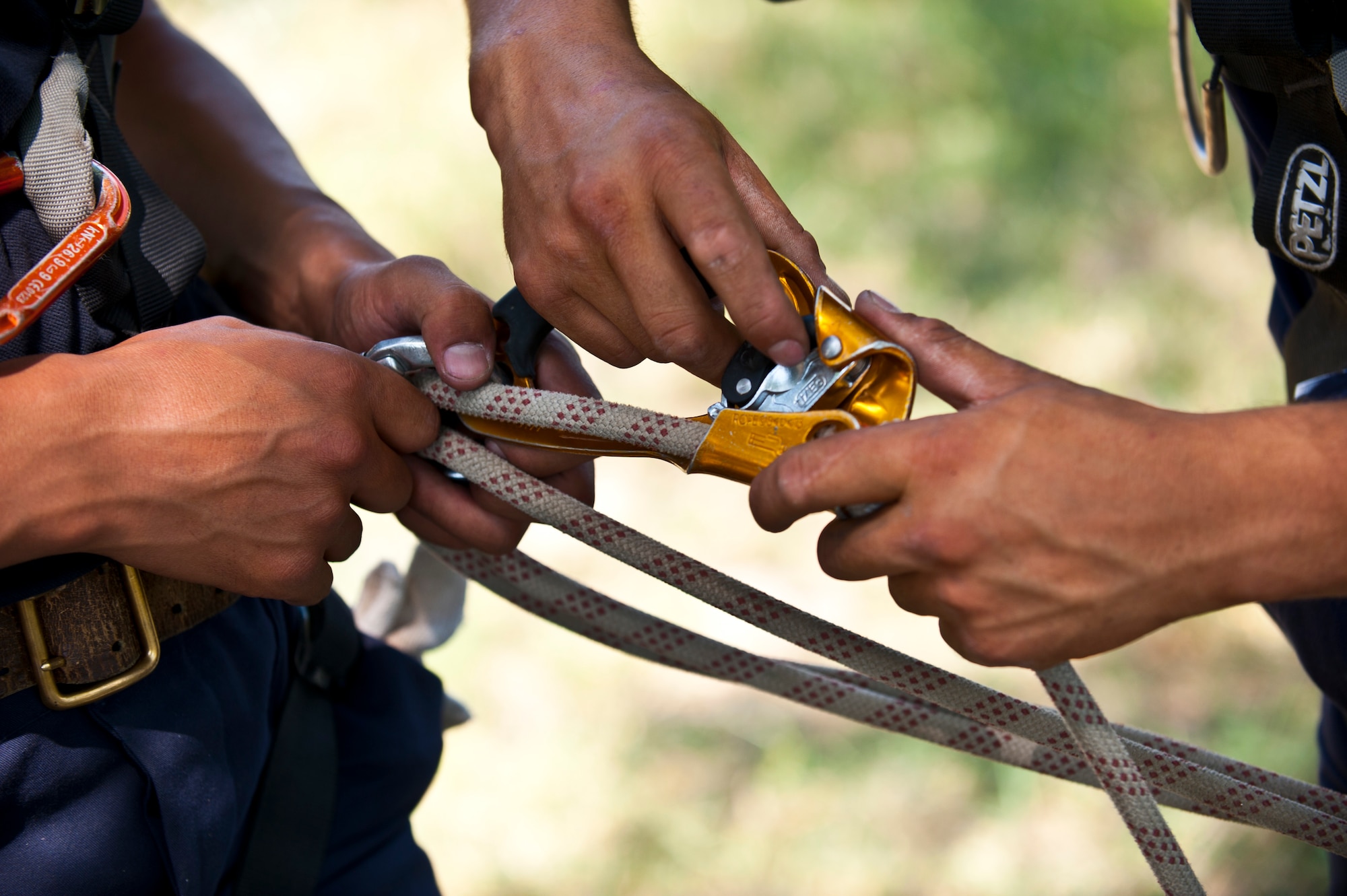Kyrgyz Republic Ministry of Emergency Situations responders prepare ropes to be utilized for a river crossing rescue training scenario during Exercise Regional Cooperation 12 at the Koi Tash Military Academy, Kyrgyzstan, June 22, 2012. The 376th Expeditionary Civil Engineer Squadron emergency management flight and the Ministry of Emergency Situations partnered to perform in hands-on training scenarios in the exercise. Regional Cooperation 12 is a multinational exercise designed to strengthen relationships and promote regional cooperation among the participating nations while offering coordinated, rapid response scenarios in the event of a disaster affecting multiple countries within the region. (U.S. Air Force photo/Senior Airman Brett Clashman)