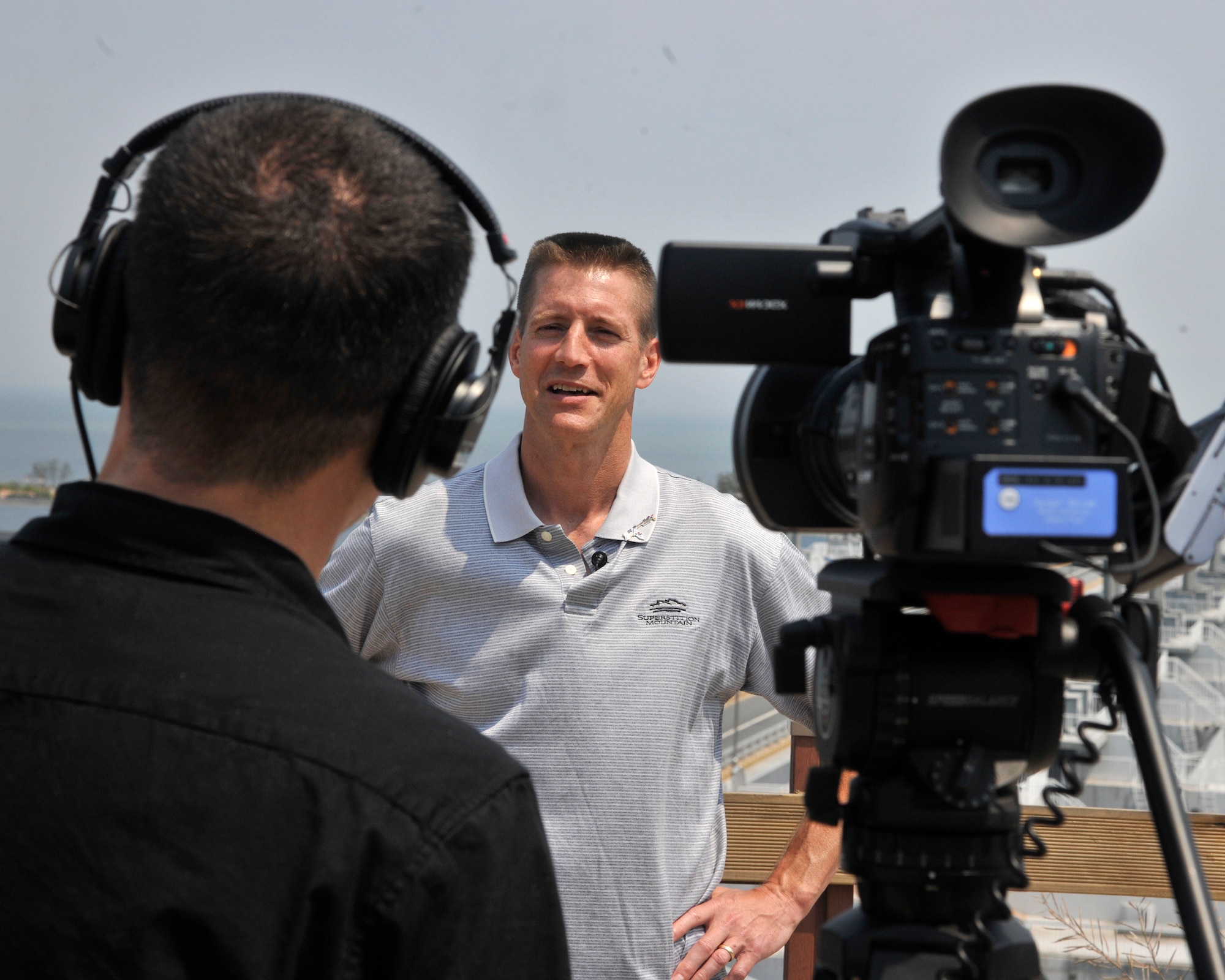 Staff Sgt. Michael Schocker, left, 8th Fighter Wing broadcaster, interviews Col. Douglas Nikolai, 8th FW vice commander, at the Saemangeum Seawall, Republic of Korea, June 20, 2012. As a new and returning member of the Wolf Pack, the vice commander was happy to see how much Gunsan City has grown since his last assignment to the peninsula. (U.S. Air Force photo/Senior Airman Marcus Morris)