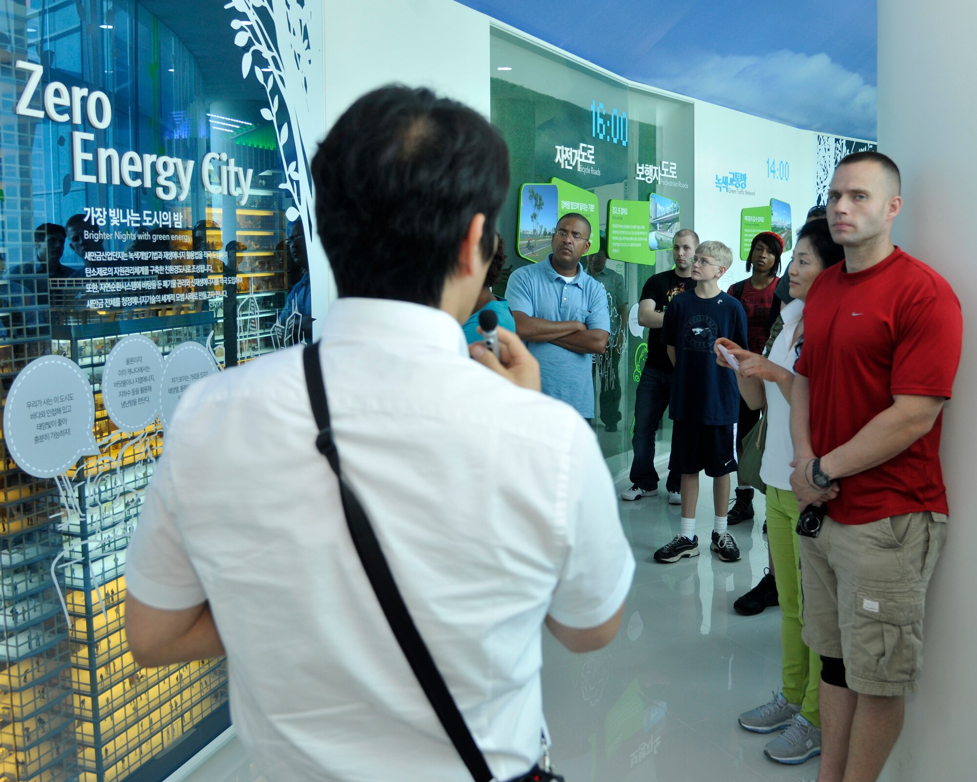 Seongho Lee, left, with the Korea Rural Community Corporation public relations team, gives 8th Fighter Wing members a tour of the zero energy city project in Gunsan, Republic of Korea, June 20, 2012. This tour was designed to educate new people in the 8th FW about what their host country accomplishes and to expose them to a new culture. (U.S. Air Force Photo/Senior Airman Marcus Morris)