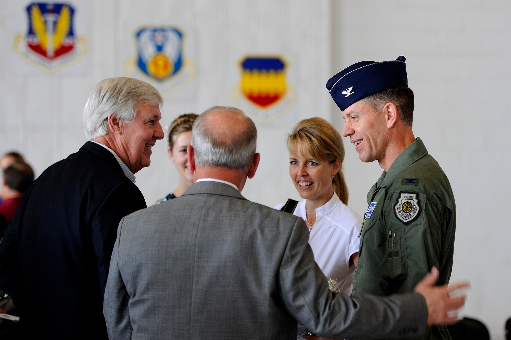 U.S. Air Force Col. Shaun McGrath, incoming 20th Operations Group commander, speaks with local Sumter County officials after taking command of the 20th OG during a change of command ceremony, June 22, 2012, Shaw Air Force Base, S.C. Col. James Sears, outgoing 20th OG commander, will be taking a new assignment at Columbus Air Force Base, Miss. while McGrath has taken over as the new 20th OG commander. (U.S. Air Force photo by Senior Airman Kenny Holston/Released) 
