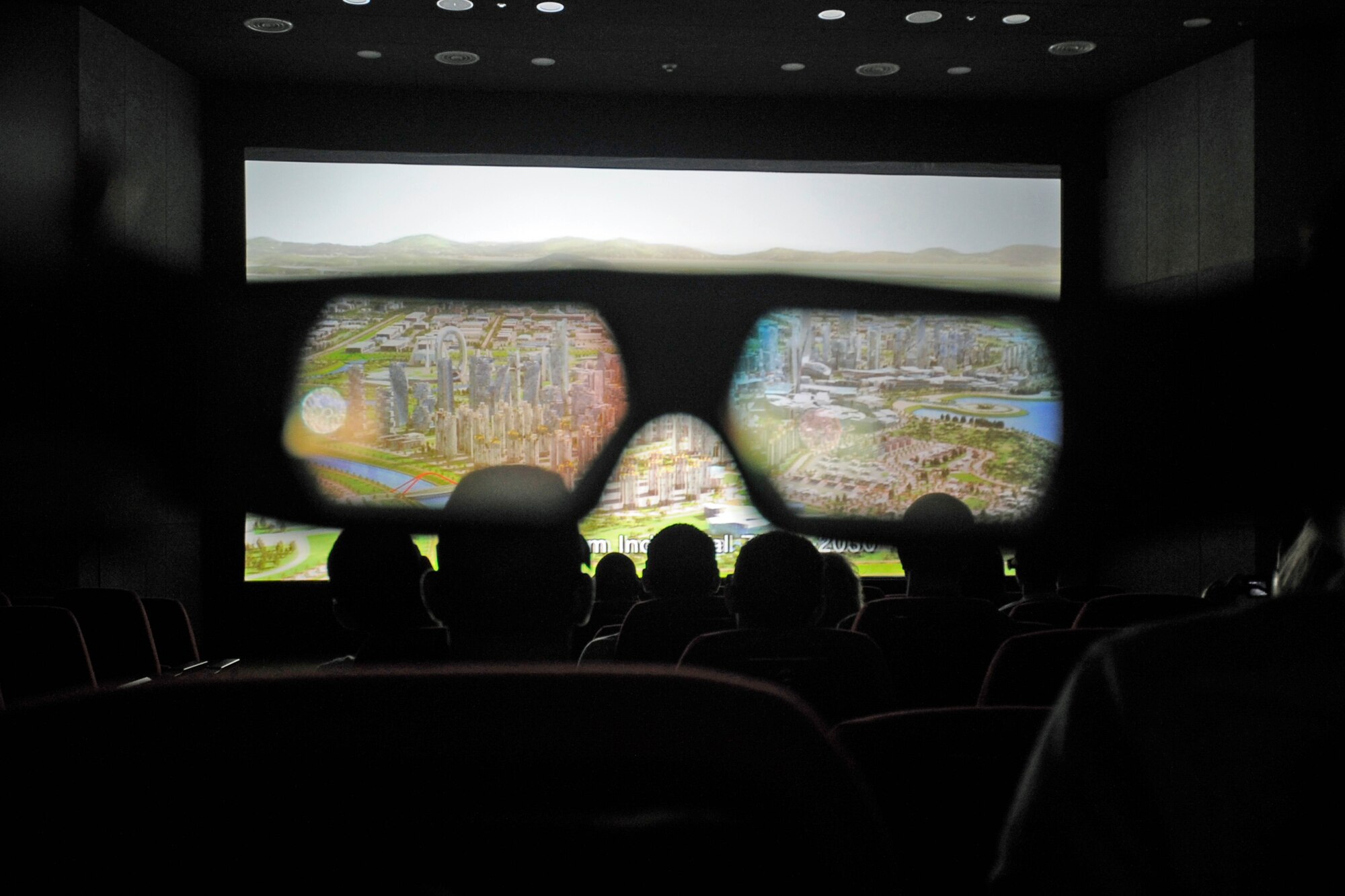 Airmen and visitors from Kunsan Air Base, Republic of Korea, watch a 3-D presentation of future development plans for the Saemangeum Land Recovery Project, June 20, 2012, in Gunsan City. The project is expected to be completed in 2030 and will give future Airmen another reason to get out and explore South Korea. (U.S. Air Force photo/Senior Airman Jessica Hines)