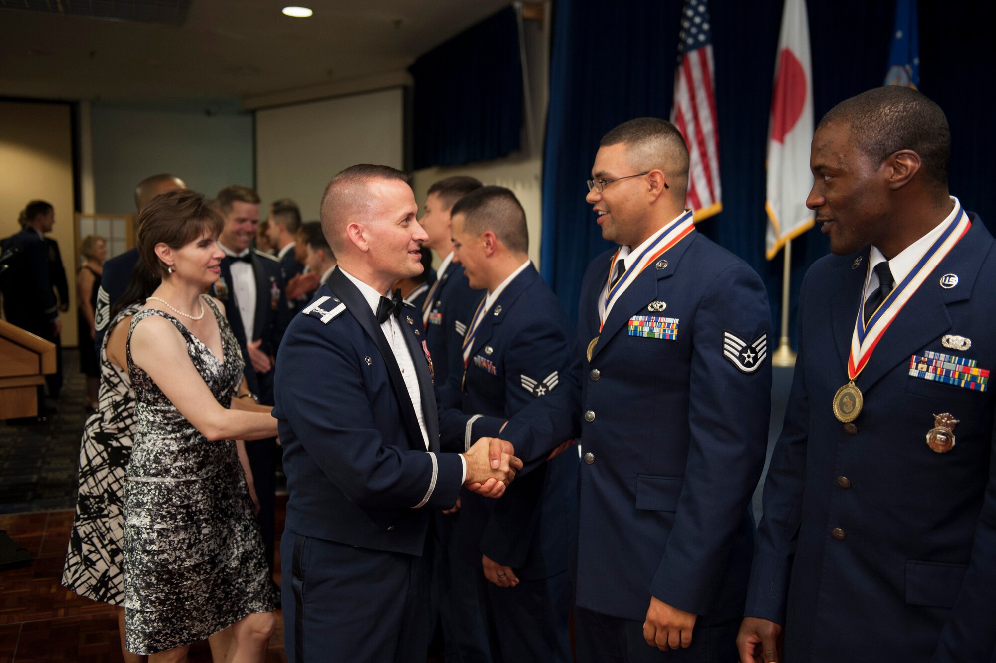 YOKOTA AIR BASE, Japan -- Col. Bill Knight, 374th Airlift Wing commander, congratulates Staff Sgt. David Gaines, 374th Civil Engineer Squadron and Airman Leadership School Class 12-E John L. Levitow Award winner during the ceremony June 21, 2012, at Yokota Air Base, Japan. The Levitow Award is the highest honor awarded during Air Force Professional Military Education. (U.S. Air Force photo by Tech. Sgt. Samuel Morse)