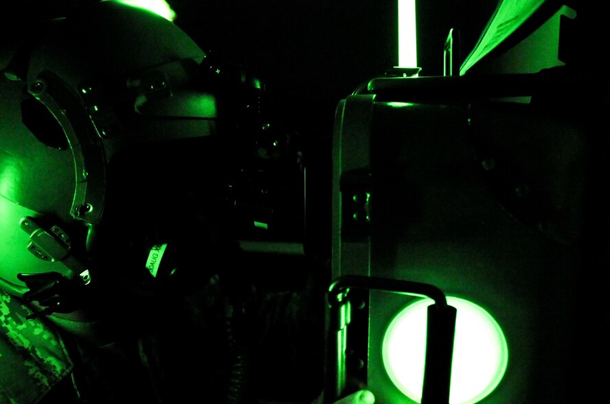 Airman 1st Class Tyler Shepherd, 2nd Operations Support Squadron aircrew flight equipment apprentice looks through a Hoffman 20/20 machine  wearing a pair of AN/AVS-9 night vision goggles on Barksdale Air Force Base, La., June 21. The Hoffman is used to calibrate the NVGs to the pilot's eyesight. This process is done in the dark to protect the image intensifier inside the goggles. (U.S. Air Force photo/Senior Airman La'Shanette V. Garrett)(RELEASED)