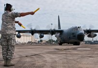 Master Sgt. Kent Castro, of the 919th Aircraft Maintenance Squadron, marshals out Aircraft 64-0523 “Godfather” to its final flight June 22 at Duke Field, Fla.  The final flight landed at Cannon Air Force Base, N.M., where 0523 is scheduled to be a static display at the base’s airpark.  The aircraft has the distinction of leading the Air Force’s assault force during the Son Tay Raid to rescue prisoners of war in Vietnam in 1970.  (U.S. Air Force photo/Tech. Sgt. Samuel King Jr.)