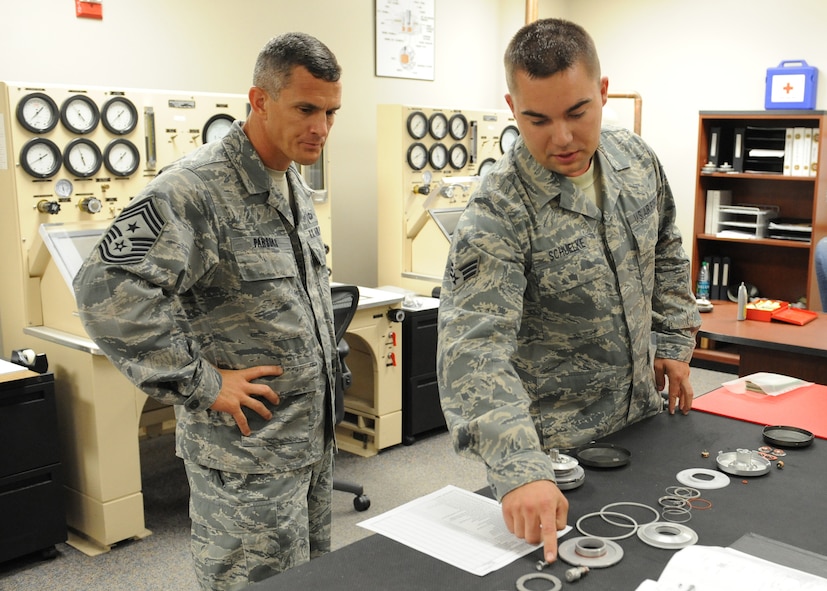 Staff Sgt. Evan Schuelke, 9th Physiological Support Squadron life support technician, explains parts of the U-2 Dragon Lady pressure suit to Chief Masters Sgt. Richard Parsons, command chief of Air Combat Command, June 21, 2012 at Beale Air Force Base, Calif. Parsons was introduced to the U-2 mission with a viewing of a full pressure suit and a chase car orientation. (U.S. Air Force photo by Mr. John Schwab)