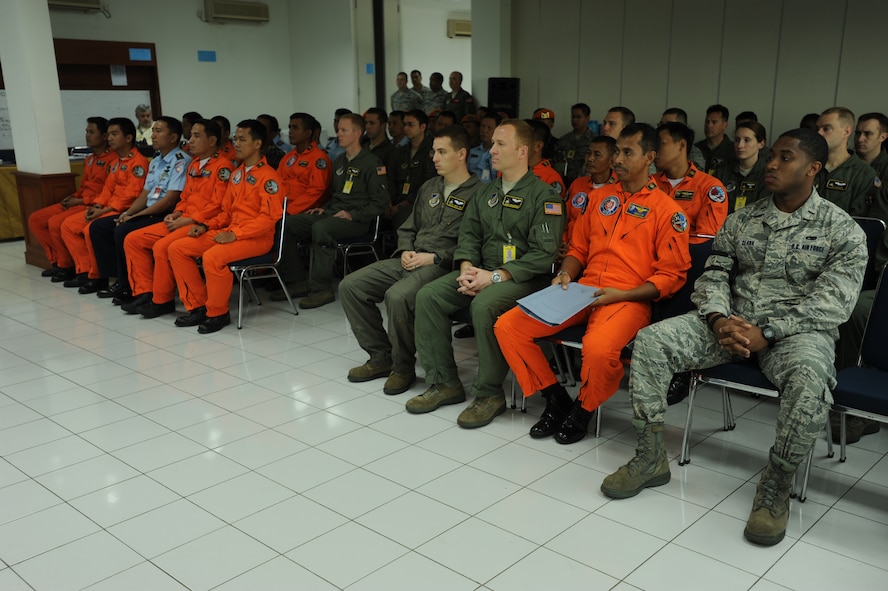 U.S. and Indonesian Airmen attend the opening ceremony for Cope West 2012 at Halim Air Base, Indonesia, June 25. Three C-130 Hercules and 80 Airmen from Yokota AB, Japan, and one C-130 and 75 Airmen from the Indonesian Air Force will participate in CW12. During Cope West the Airmen will exchange airlift, air-land, and airdrop delivery techniques that will enhance their ability to respond to regional disasters. (U.S. Air Force photo/Master Sgt. Victoria Meyer) 