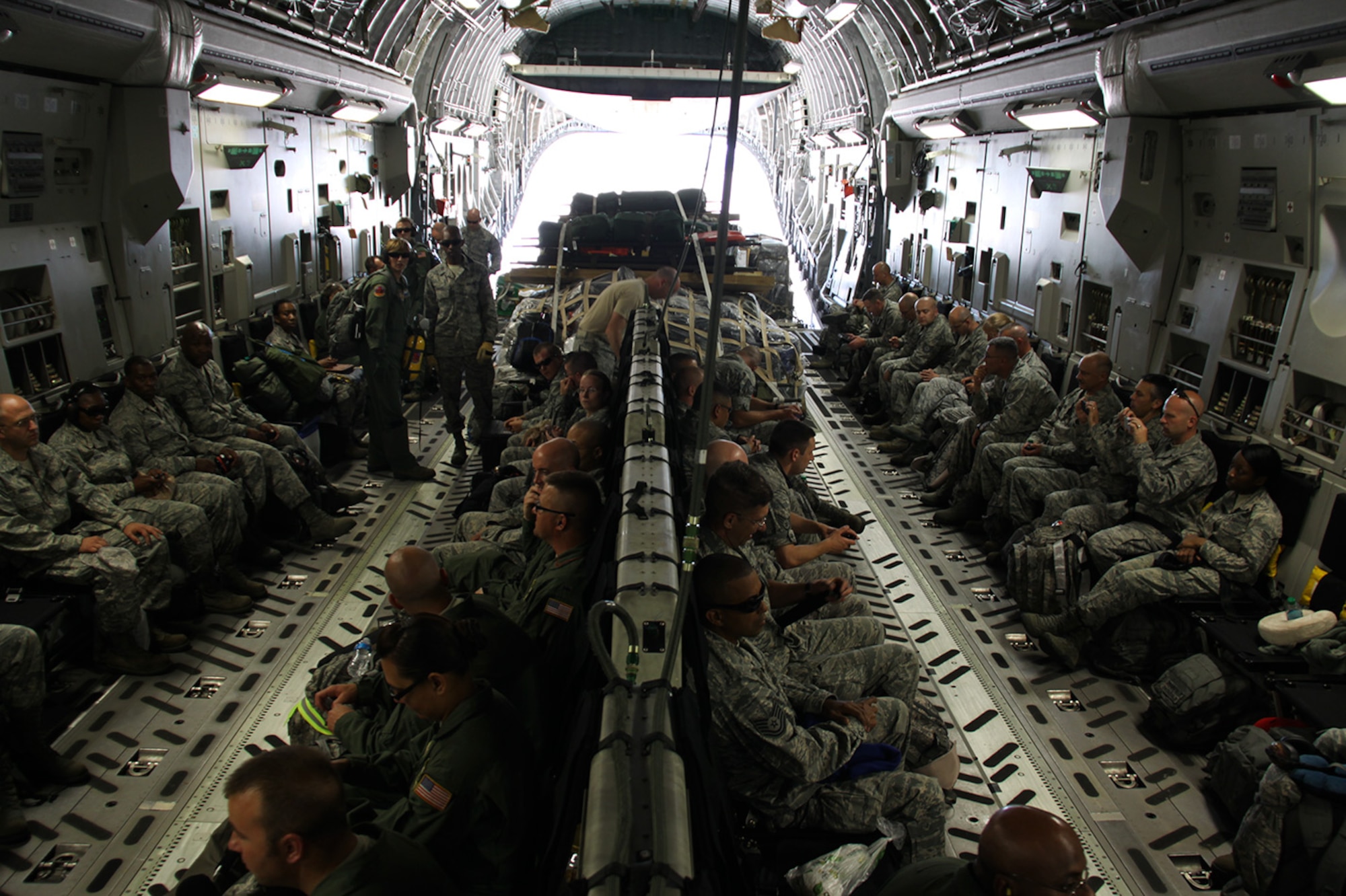 A total of 26 Airmen from the 911th Airlift Wing prepare for departure to Fort Hunter Liggett, Calif., aboard a C-17 Globemaster III, June 14, 2012 to participate in the Global Medic Field Training Exercise. Global Medic is the only Air Force Reserve Command sanctioned exercise that partners with the Army Reserve and generates the largest single comprehensive joint field training program.  Also on board the aircraft are fellow Airmen from Joint Base McGuire, N.J., and Pope Air Force Base, N.C. . (U.S. Air Force photo by Airman 1st Class Justyne Obledobel/Released)