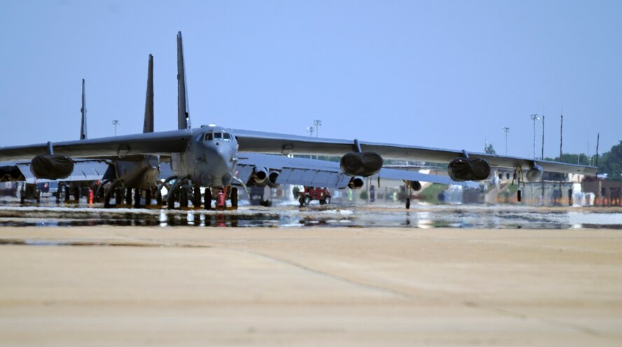 B-52H Stratofortress bombers sit on the flightline on Barksdale Air Force Base, La., June 25. Due to constant exposure to sunlight, a B-52 must be painted every four years to maintain its dark grey color. The dark grey color helps the B-52 blend in when flying at higher altitudes, at night or over large bodies of water. (U.S. Air Force photo/Airman 1st Class Micaiah Anthony)(RELEASED)  