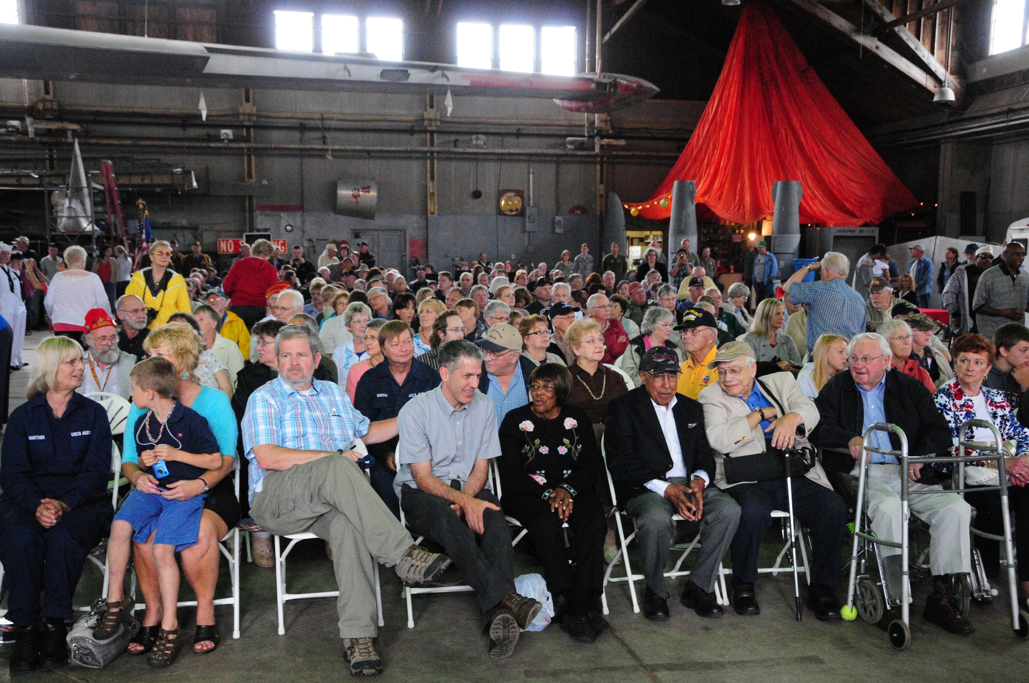 Maj. (Ret.) Joe Gomer and more than 200 family, friends and
community members attend a dedication ceremony June 23, 2012 at the
Commemorative Air Force hangar, Duluth, Minn. A bronze life-sized statue of
Gomer was unveiled, honoring his service and dedication during World War II.
(National Guard photo by Staff Sgt. Don L. Acton.)
