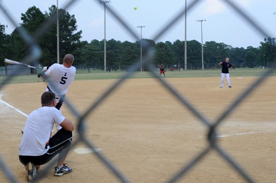 U.S. Air Force Master Sgt. Tony Patrick hits a ball to left field during the base intramural softball championship game on Seymour Johnson Air Force Base, N.C., June 21, 2012. After eight innings of play, Ammo won 13 to 4. Patrick, 4th Equipment Maintenance Squadron munitions inspector, is from Billings, Mont. (U.S. Air Force photo/Airman 1st Class John Nieves Camacho/Released)