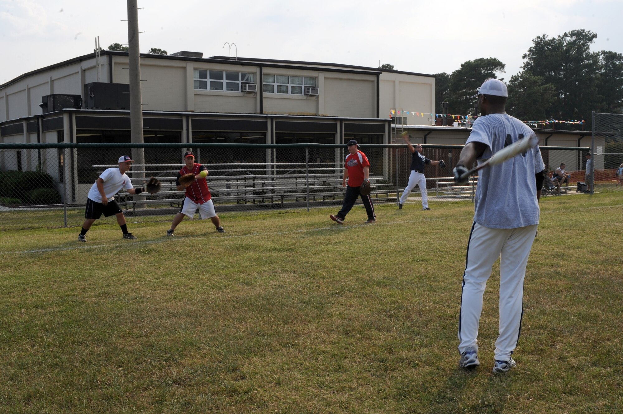 Players on the 4th Equipment Maintenance Squadron Ammo team warm up before the base intramural softball championship game on Seymour Johnson Air Force Base, N.C., June 21, 2012. Ammo completed the regular season with 11 wins and three losses, while the Aircrew Ground Equipment team finished with 10 wins and two losses. (U.S. Air Force photo/Airman 1st Class John Nieves Camacho/Released)