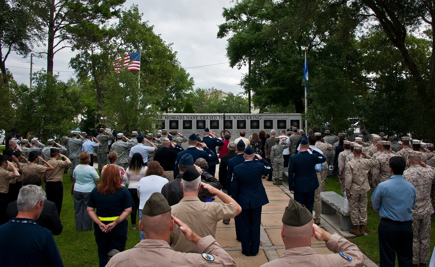 Amid gusting winds and threatening rain clouds from Tropical Storm Debby, Airmen, Marines, Sailors and family members gathered to remember 19 warriors and 12 33rd Fighter Wing Nomads on the 16th anniversary of the Khobar Towers bombing June 25 at Eglin Air Force Base, Fla.  (U.S. Air Force photo/Samuel King Jr.)