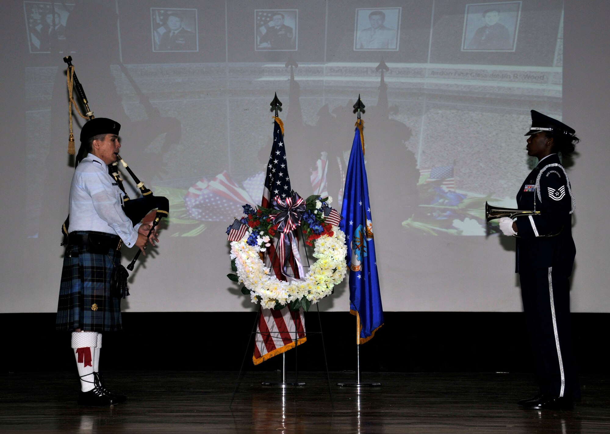 PATRICK AIR FORCE BASE, Fla.-- Bagpiper 1st Lt. Edward Tabbutt, 45th Space Wing, Patrick AFB (on left) and bulgiest Tech. Sgt. Jackie Greer, 920th Rescue Wing, Patrick AFB played Taps at the conclusion of the Khobar Towers remembrance ceremony held here June 25. Each year, friends, family members, and fellow rescue Airmen gather to remember and pay respect to those who lost their lives during the 1996 bombing of the Khobar Towers, Dhahran Air Base, Saudi Arabia. (U.S. Air Force photo/Tech. Sgt. Peter Dean)   

 