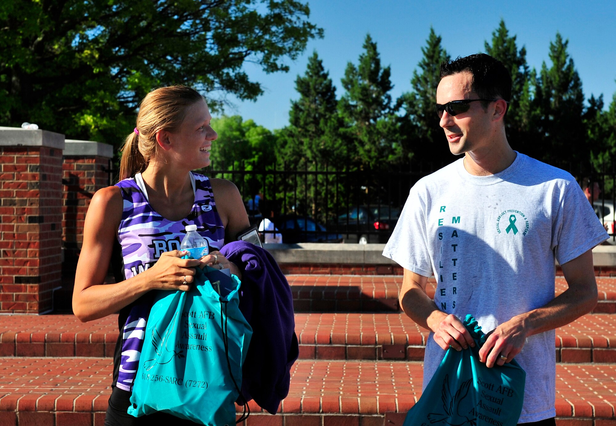 First place winners female category Nicole Wilcox and male category Capt. David Bereda, are recognized after completing the Sexual Assault Response Coordinator sponsored 5k June 22, at Scott Air Force Base, Ill. (U.S. Air Force photo/ Staff Sgt. Stephenie Wade)
