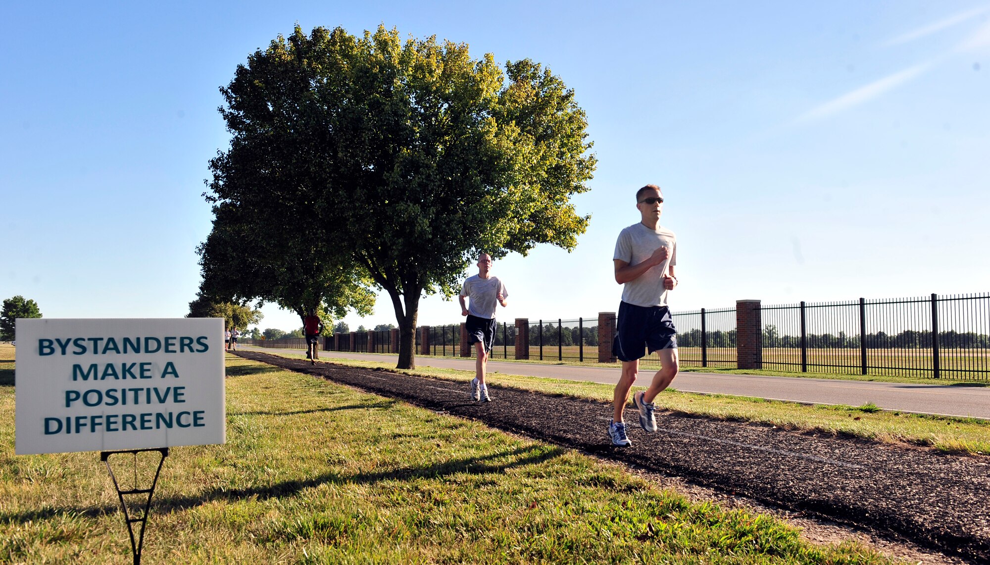 Team Scott members take off running from the parade field signifying the beginning of the Sexual Assault Response Coordinator sponsored 5k June 22, at Scott Air Force Base, Ill. The run was organized spread sexual assault prevention and awareness throughout the base. (U.S. Air Force photo/ Staff Sgt. Stephenie Wade)