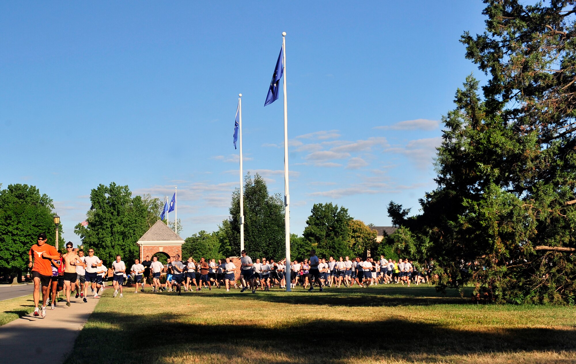 Team Scott members take off running from the parade field signifying the beginning of the Sexual Assault Response Coordinator sponsored 5k June 22, at Scott Air Force Base, Ill. The run was organized spread sexual assault prevention and awareness throughout the base. (U.S. Air Force photo/ Staff Sgt. Stephenie Wade)