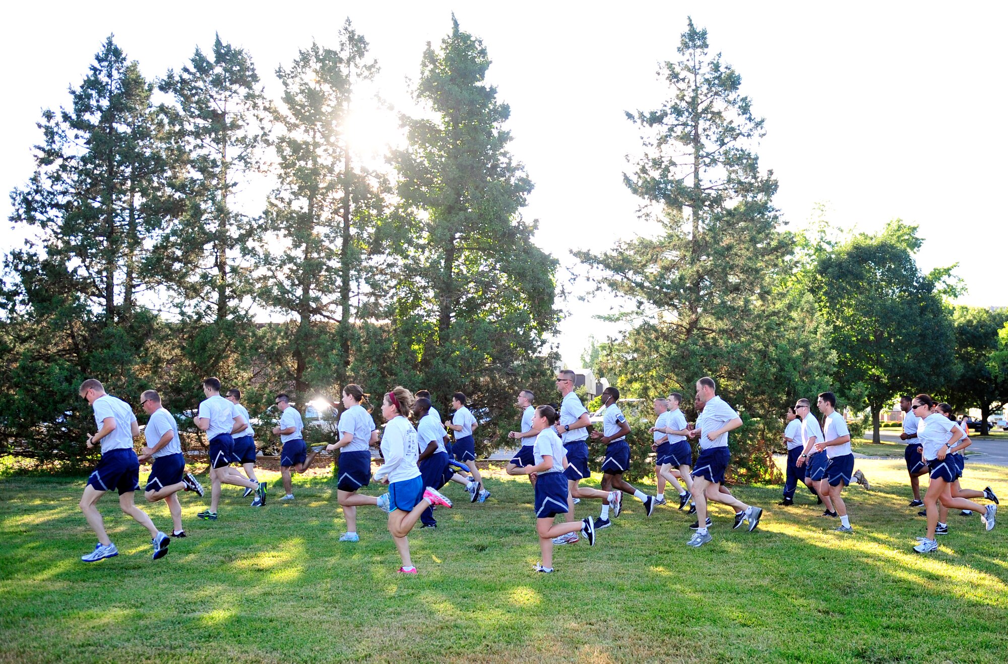 Members from the 375th Air Mobility Wing Staff Agencies stretch and warm up prior to participating in the Sexual Assault Response Coordinator sponsored 5k June 22, at Scott Air Force Base, Ill. The run was organized spread sexual assault prevention throughout the base. (U.S. Air Force photo/ Staff Sgt. Stephenie Wade)