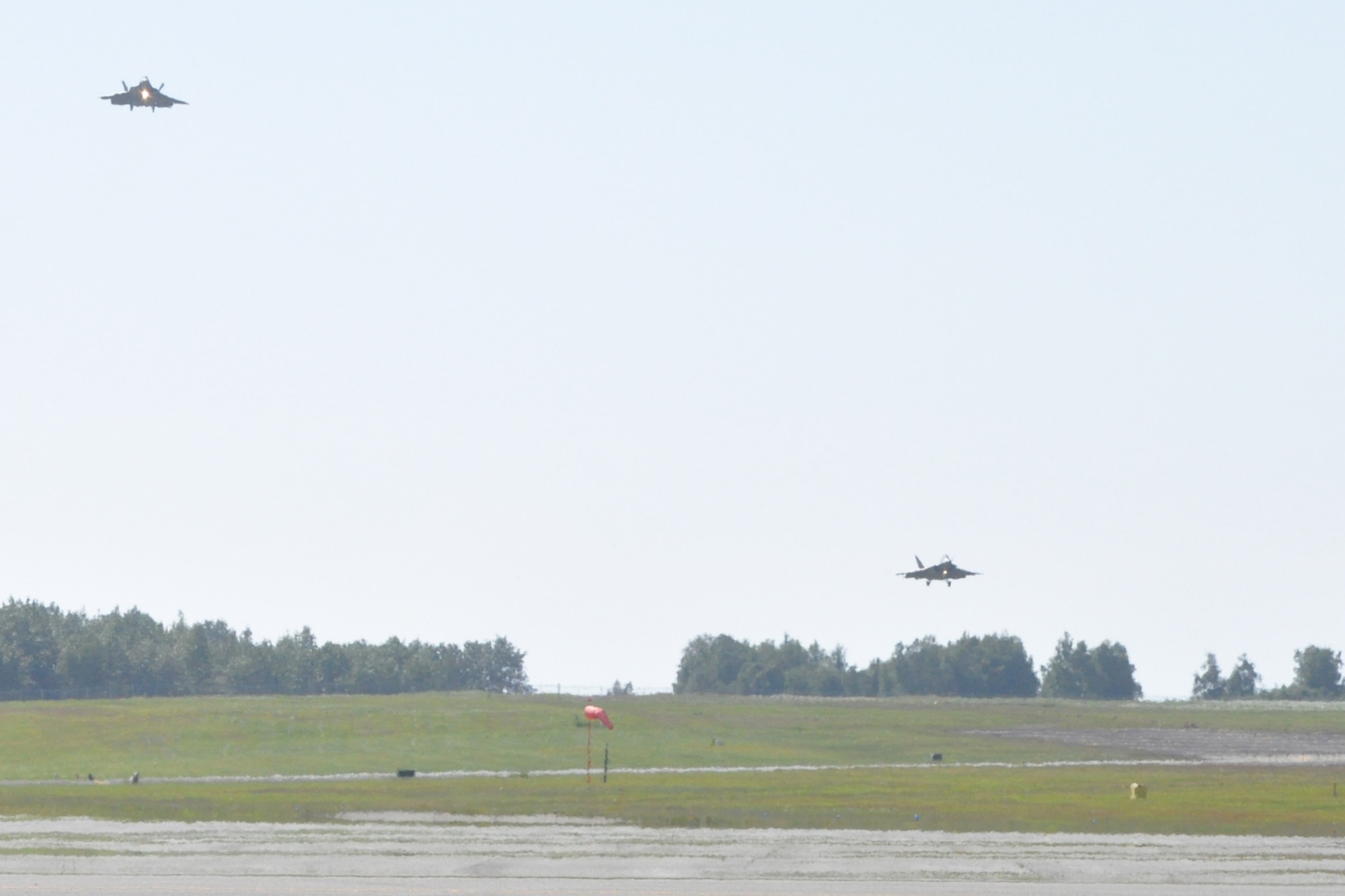 JOINT BASE ELMENDORF-RICHARDSON, Alaska --- 525th Fighter
Squadron "Bulldogs" prepare to land F-22s at JBER June 20, 2012 after flying
sorties in Red Flag-Alaska. Red Flag-Alaska 12-2, June 6-22, was the first
multi-national RF-A in which F-22s cleared the skies of simulated enemies
for partner nations. (U.S. Air Force photo/Luke Waack)
