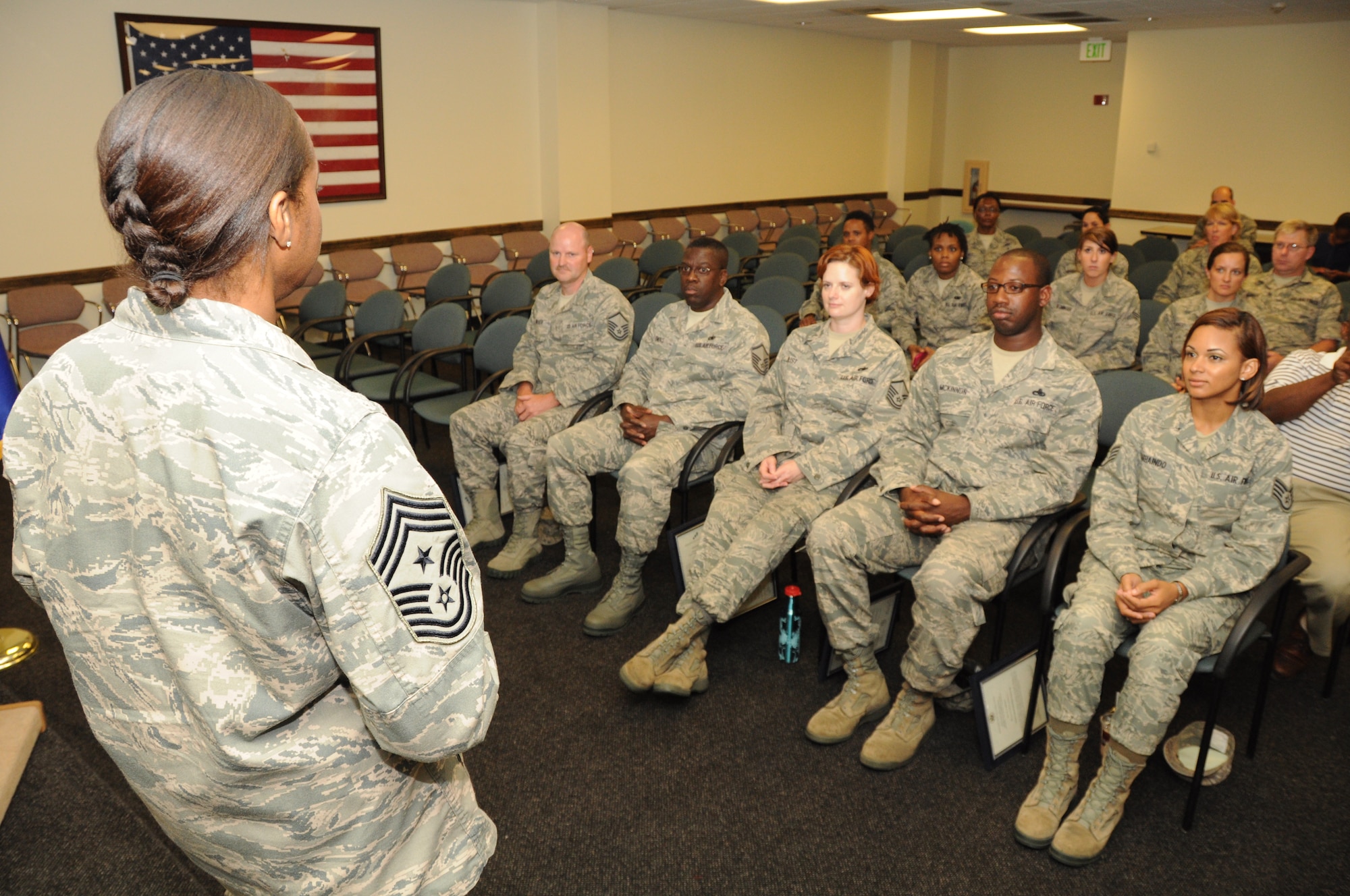 Chief Master Sgt. Gigi Manning, 315th Airlift Wing command chief master sergeant, addresses the newest NCO and Senior NCOs during a 315 AW NCO and SNCO induction ceremony June 23, 2012 at Joint Base Charleston, S.C. (U.S. Air Force Photo/Staff Sgt. Shane Ellis)