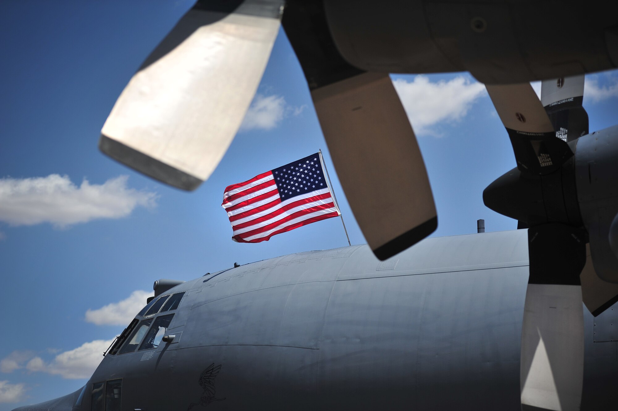 An American flag is displayed on top of the newly arrived MC-130E Combat Talon I, tail number 64-0523, during an aircraft retirement ceremony at Cannon Air Force Base, N.M., June 22, 2012.  This particular Talon 1 was the lead aircraft that performed a Prisoner of War extraction in North Vietnam called the Son Tay Raid in 1970.  (U.S. Air Force photo by Airman 1st Class Alexxis Pons Abascal)  