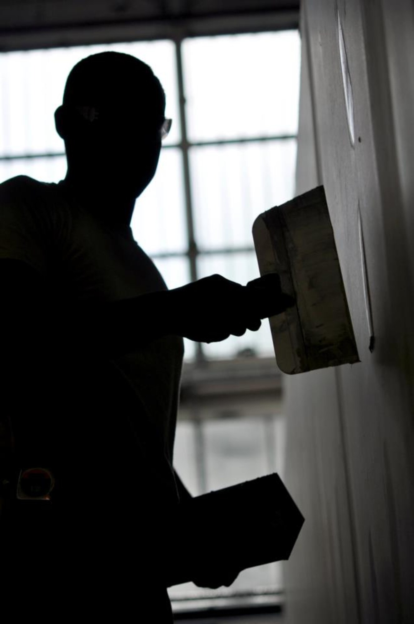 Senior Airman William Shelden, 442nd Civil Engineers Squadron structures technician, performs mudding and sanding on drywall on a facility the squadron is helping build while on temporary duty at RAF Mildenhall, England. The 442nd CES is part of the 442nd Fighter Wing, an A-10 Thunderbolt II Air Force Reserve unit at Whiteman Air Force Base, Mo. (U.S. Air Force photo/Staff Sgt. Danielle Johnston)